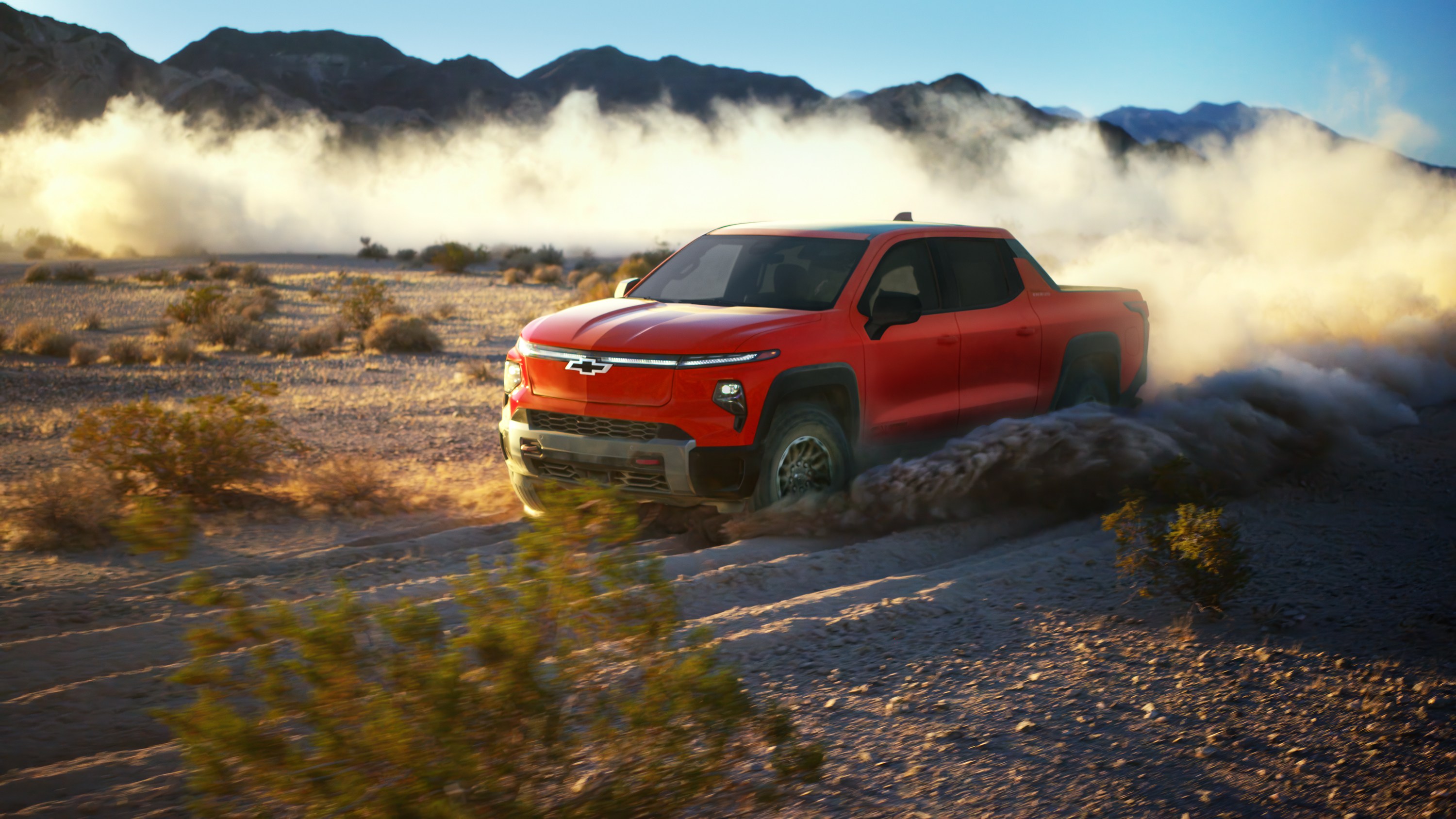 2026 Chevrolet Silverado EV Trail Boss in Habanero Orange, current-generation press still